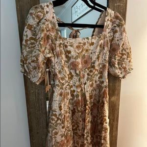 VICI mini dress with a flower pattern. It has a very pretty back.